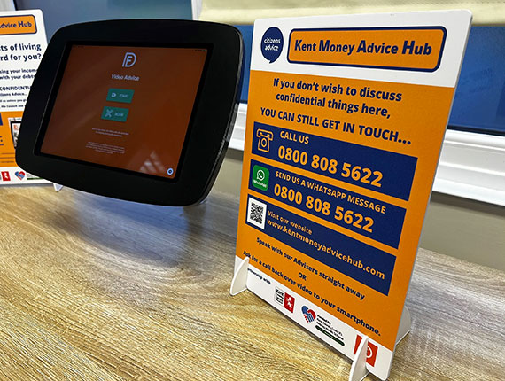 A kiosk with a touch screen device for people to access the Kent money advice hub